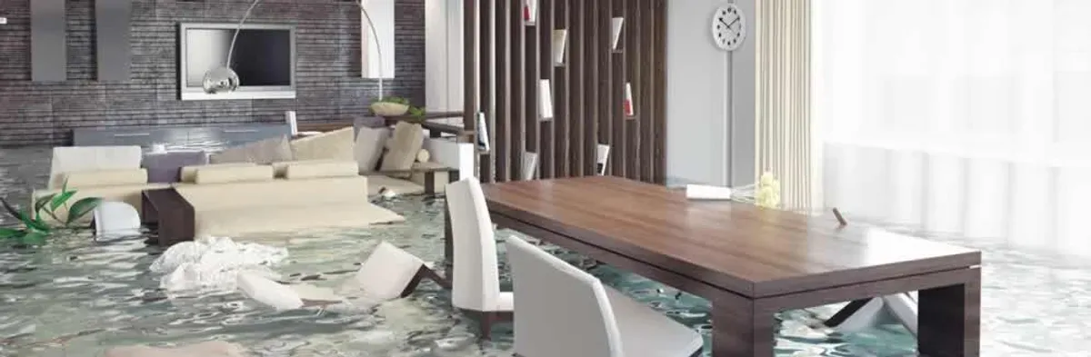 home interior affected by water damage with flooded floors and displaced furniture in Reno, NV